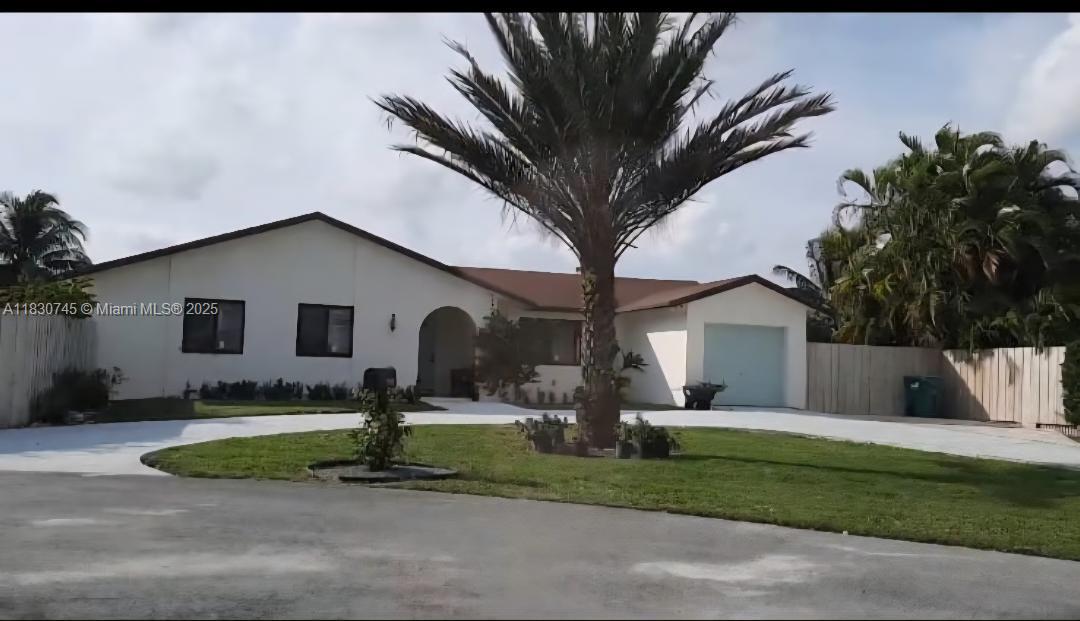 This property sits on a spacious (approximately 18,000 Sq/ft) lot at the end of a cul-de-sac in a fast-growing community, rising property values. If offers plenty of outdoor space to build a pool, park an RV, or just for entertaining. The property has lush landscaping and mature bushes that create privacy around the yard. Located minutes away from the expressway, the gateway to Key West or Miami. Inside, you'll enjoy peace of mind with new impact windows, 5-year-old AC unit and spacious Master bedroom with walk-in closet. This gem won't last. No HOA