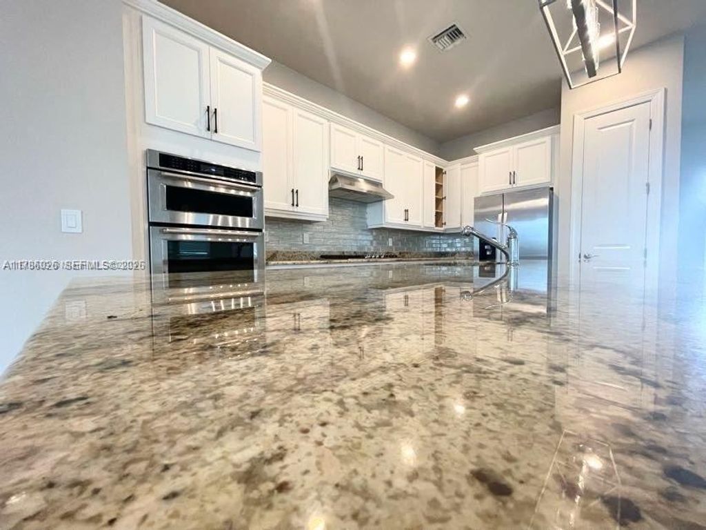 Photo of 12476 Nautilus Cir #12476, Palm Beach Gardens, FL 33412 (MLS # A11786026)