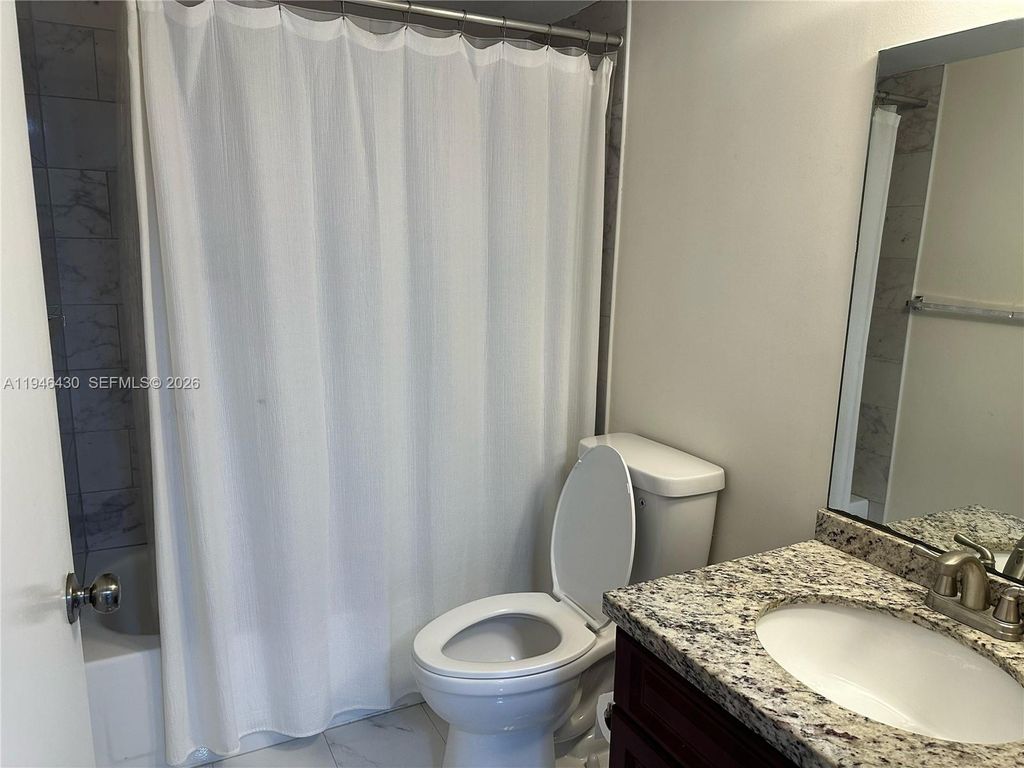 Photo of 2240 N Cypress Bend Dr #805, Pompano Beach, FL 33069 (MLS # A11946430)