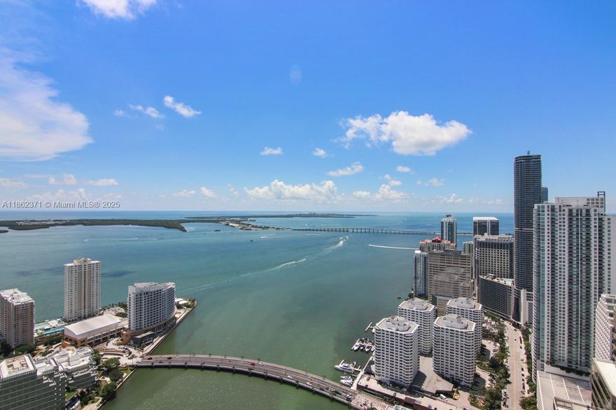 This spacious, bright one-bedroom, one-bath condo boasts over one thousand square feet of interior space. It features white porcelain tiled floors in the living areas, marble bathroom floors , a large walk-in closet, and premium Wolf and Sub-Zero kitchen appliances. Enjoy ten-foot-high ceilings, floor-to-ceiling glass windows, and stunning Biscayne Bay and city skyline views from the fifty-sixth floor. This is the largest one-bedroom floor plan at Icon Brickell and includes one assigned parking space.