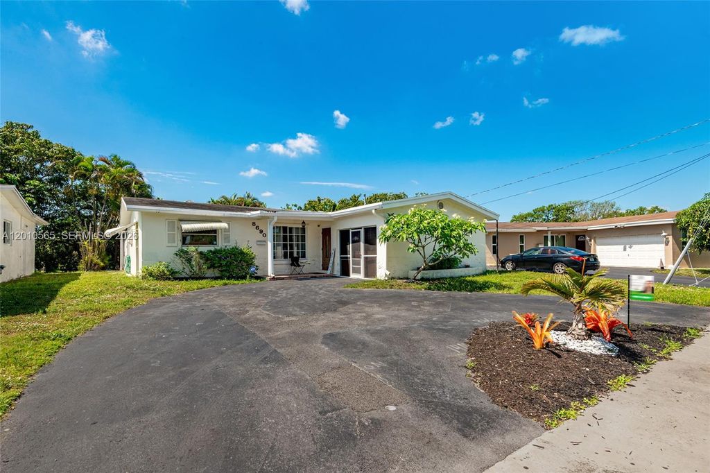 Photo of 8690 NW 24th Pl, Sunrise, FL 33322 (MLS # A12010565)