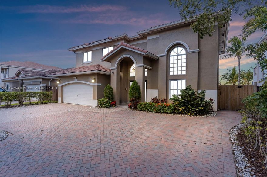Stunning 4/3.5 turnkey home in the desirable Venezia Lakes, Kendall, located on a serene lake. This meticulously maintained property features new full interior and exterior paint, new AC, new impact windows, and a resurfaced pool. The expansive paver driveway has been upgraded to allow more spacious parking, the entire home boasts brand-new concrete-style floors along with remodeled bathrooms. Additional highlights include a whole-home generator for peace of mind during hurricane season. Bring your boat or jetski, lake is motorized friendly and ready for the whole family to enjoy. Don't miss this move-in-ready gem!