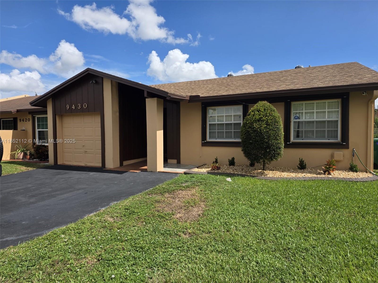 Beautiful, well-kept corner villa with serene lake views in The Meadows of Miramar! This 3-bedroom, 2-bathroom home features a spacious layout with a converted garage that adds extra living area. Part of the screened-in patio has been transformed into a formal dining room with its own A/C mini split. The interior has been freshly painted, and the home includes updated plumbing, a tankless water heater, and accordion shutters throughout for added comfort and security. Enjoy a fenced backyard and convenient driveway parking, all nestled in a quiet, welcoming neighborhood—move-in ready and waiting for you!