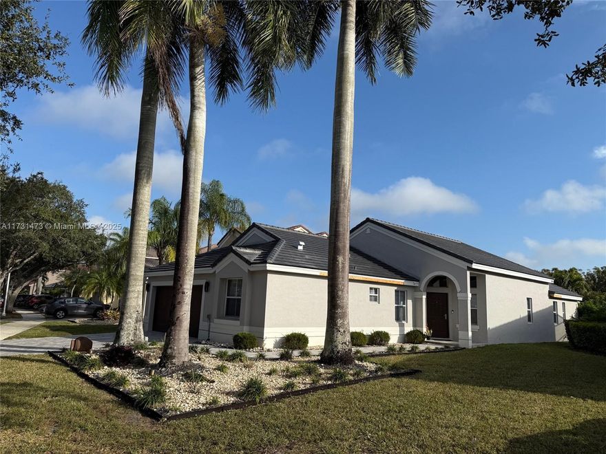 Beautiful and completed upgraded home in The Falls - Weston. This is a jewel home that won't last. Lake view and private pool. New roof - 2025. Social area tiles installed in 2024. Luxury vinyl floor that look like tiles in bedrooms. Home interior was painted in 2024. Wall unit with electric fire place put in 2024. Renovated bathrooms and kitchen with Quartzite top. A/C Rheem 2023. Aluminium fence. Pool with salt water, diamond brite finish, pool heater, lights, travertine deck, exterior shower, electric retractable awnings and pergola. Exterior commercial grade - light brass finishes. Driveway renovated in 2020 - Travertino pavers. Exterior painting 2020. Zebra shades with two electric rolls on sliding doors. See attached Feature sheet.