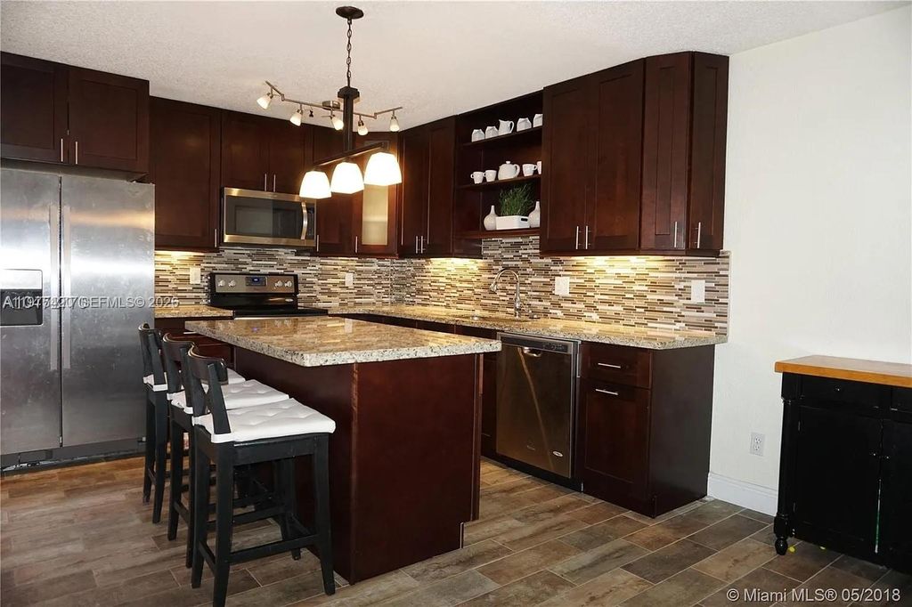 Photo of 11881 SW 13th Ct, Davie, FL 33325 (MLS # A11975420)