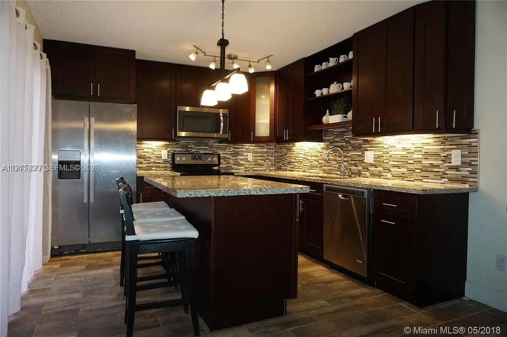 Photo of 11881 SW 13th Ct, Davie, FL 33325 (MLS # A11975420)