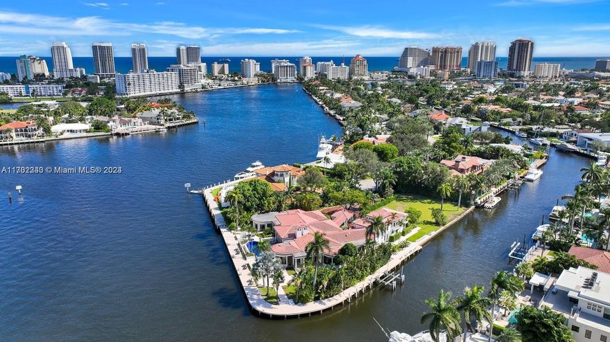 BUILDERS DREAM! Luxurious and one of a kind Estate in Las Olas! Idyllically located on a private 1.14-acre point lot on the Rio Grande Canal, this 7BR/7.5BA, 8,132sqft abode impresses with jaw-dropping Mediterranean architectures and 550’ of protected waterfront for mega-yachts. The impeccable interior features towering ceilings, exotic marble floors and a gourmet kitchen with premium stainless appliances. Entertainment-ready, the home boasts a billiard room, bar, lounge, sparkling pool, and intoxicating water views. The first-floor master bedroom pampers with coffered ceilings, a walk-in closet, hardwood floors, pool access, and a European spa-inspired en suite with a Romanesque shower and a deep soaking tub. 3-car garage, laundry area, guest home and quick access to ocean.