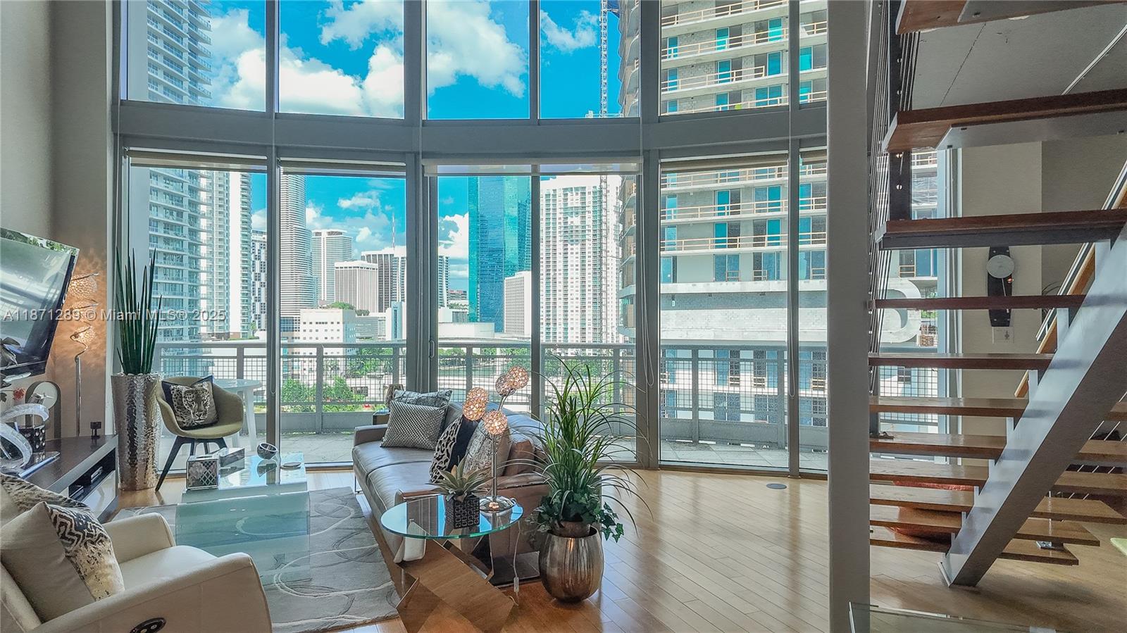 Live Limitless at Neo Vertika—Brickell’s Hottest Corner! This stylish two-story loft delivers the best Miami River views, soaring floor-to-ceiling windows with blackout shades, and an open layout with 2 bedrooms, 2 baths, balcony, and in-unit laundry.
With The Standard and Lofty rising next door, this block is becoming Brickell’s most exciting address. Step outside to Cajun Boil, American Social, Brickell City Centre, and the Brightline. Amenities include an infinity pool, indoor courts, riverfront gym, 24/7 valet & security—everything you need for a vibrant, walkable lifestyle.