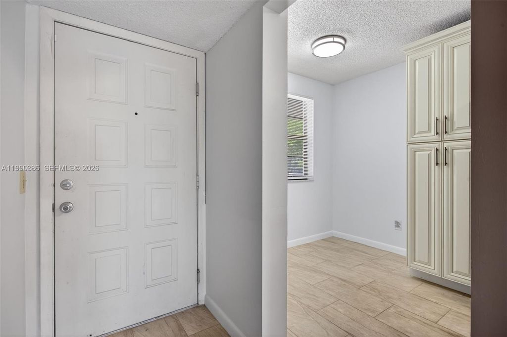 Photo of 9670 W Mcnab Rd #208, Tamarac, FL 33321 (MLS # A11990386)