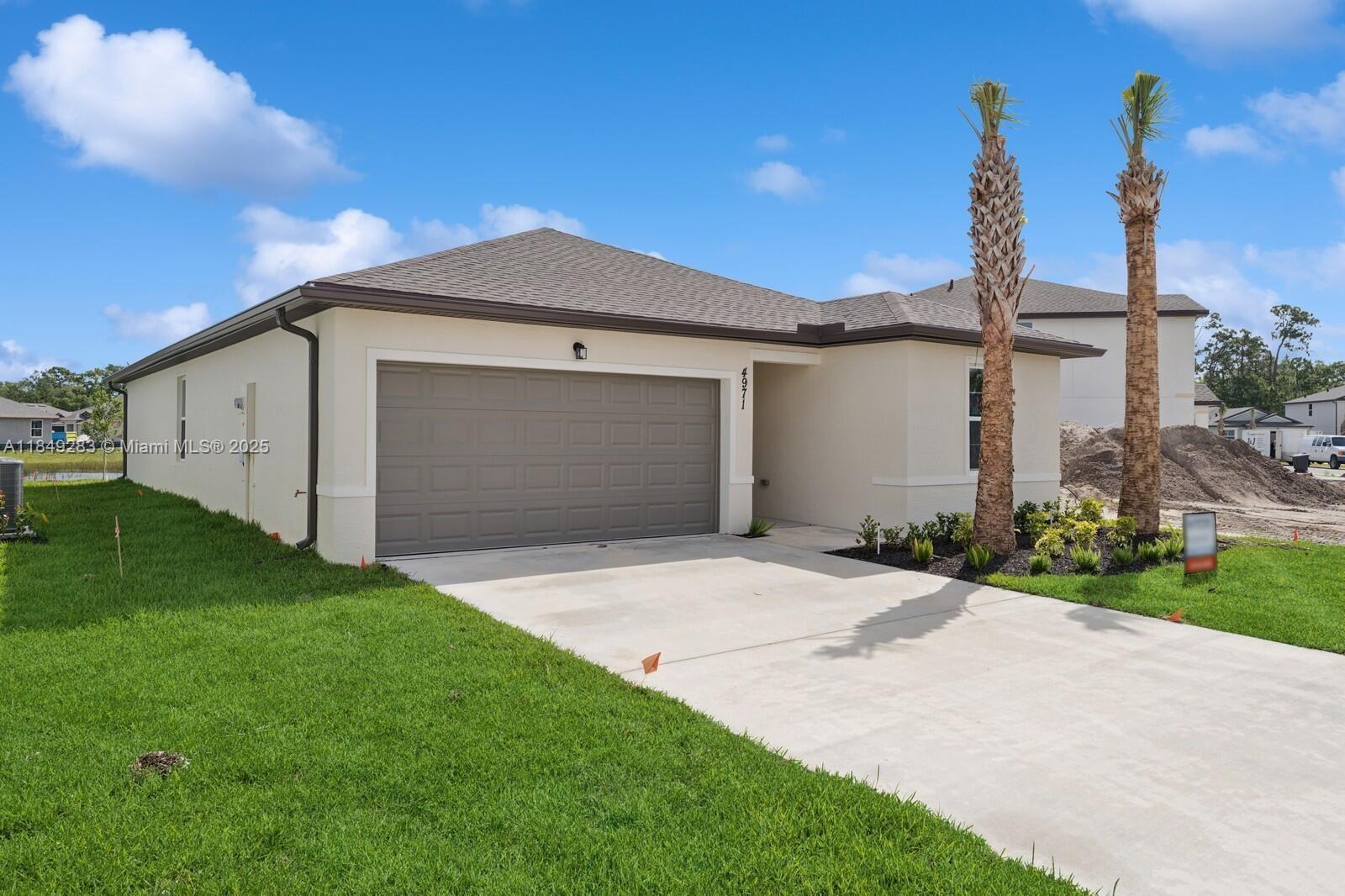 The beautiful LAKE VIEW Eden floorplan with 4 BR/2 Ba/2 car garage is the most sought after home in the neighborhood. It's bright kitchen features soft close cabinet doors, GE Stainless Steel appliances including refrigerator, granite slab on the island and countertops as well as tile throughout the home. It also has a covered lanai off the dining room - great for entertaining. Waterstone also has an great amenity center that offers a heated pool, clubhouse with a fitness center, tennis and pickleball courts, a sand volleyball court, playground and more. Waterstone is surrounded by wooded area and countryside, yet close to the shops and restaurants of both Vero Beach and Ft Pierce. A must see for people seeking a quiet sanctuary for their home.