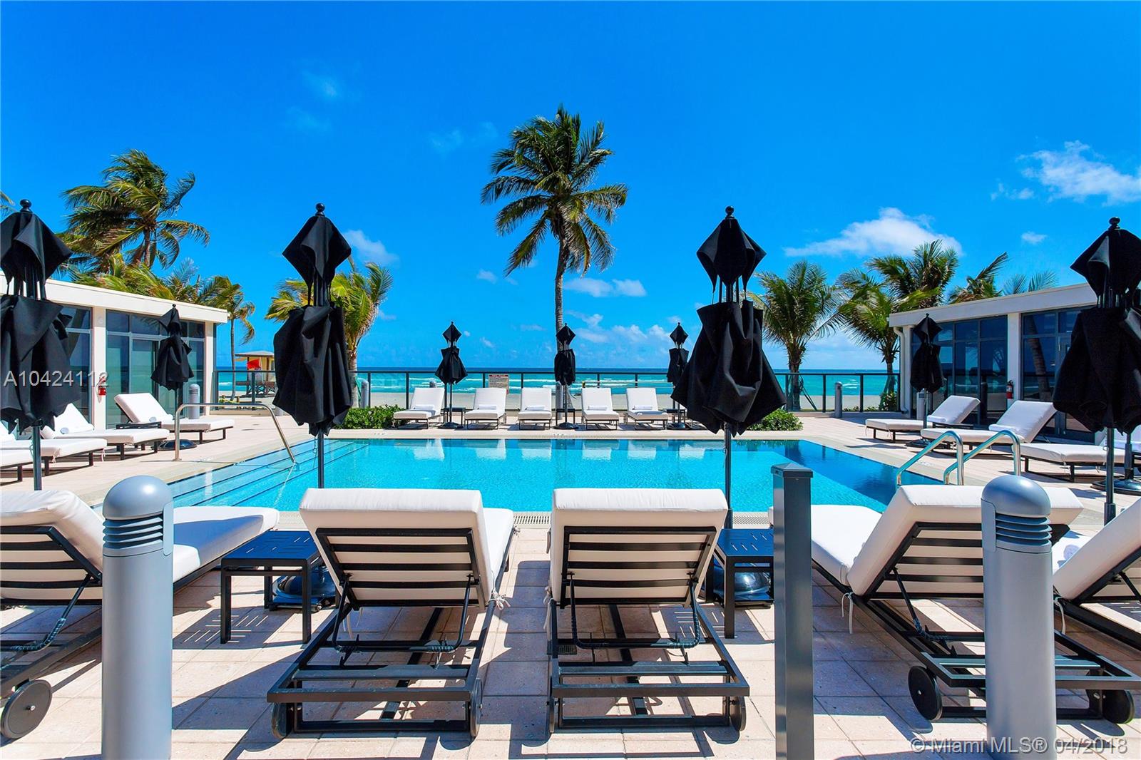 This lovely unit is located in the North tower most desirable and sought after line. This residence features a large master suite, media room with unobstructed ocean views. It also includes floor to ceiling windows, remote controlled window treatments in living area and master bedroom, custom walk-in closets, wolf and subzero appliances, wine cellar and much more. The building features a vanishing-edge pool, fitness center, private covered parking and a lush tropical landscaping.