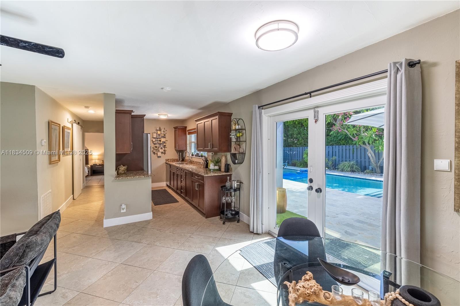 Welcome to your private tropical escape in the heart of Pompano Beach. This beautifully furnished 2-bedroom, 1-bathroom home is the ideal retreat for a relaxing short-term stay, just minutes from the beach, restaurants, and shops. The home features two comfortable bedrooms with quality linens and ample storage, a clean and modern bathroom with tub/shower, and a fully equipped kitchen complete with appliances, cookware, and dining space for four. The backyard boasts a sparkling swimming pool and a soothing jacuzzi/spa.