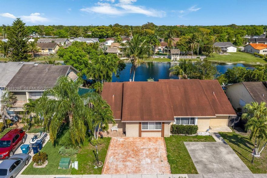 Fabulous opportunity! This 3-bedroom, 2-bath lakefront residence is located close to a cul-de-sac & is a wonderful chance to make a home your own in this peaceful setting. Officially zoned as a townhouse but designed in a one-story duplex-style layout, the home welcomes you into a spacious living and dining area upon entry.  It has a 3-bedroom, 2-bath same-side split floor plan with the layout providing separation between the primary bedroom and secondary bedrooms while keeping all rooms conveniently located on one side of the home. Moving toward the rear of the property, you'll find an ample kitchen on your right side with a convenient breakfast bar that opens to the family room—creating a functional flow for everyday living and entertaining.  A screened porch overlooks a nice-sized yard and tranquil lake views, providing a relaxing outdoor setting. The property has been generally well maintained over the years but will benefit from cosmetic updates and some repairs, offering great potential for customization and value enhancement.  The property has been generally well maintained over the years but will benefit from cosmetic updates and some repairs, offering great potential for customization and value enhancement. Please note: the existing deck over the lake is currently unsafe and in disrepair. A solid opportunity for buyers seeking lakefront living with room to improve & NO HOA.