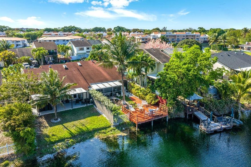 Fabulous opportunity! This 3-bedroom, 2-bath lakefront residence is located close to a cul-de-sac & is a wonderful chance to make a home your own in this peaceful setting. Officially zoned as a townhouse but designed in a one-story duplex-style layout, the home welcomes you into a spacious living and dining area upon entry.  It has a 3-bedroom, 2-bath same-side split floor plan with the layout providing separation between the primary bedroom and secondary bedrooms while keeping all rooms conveniently located on one side of the home. Moving toward the rear of the property, you'll find an ample kitchen on your right side with a convenient breakfast bar that opens to the family room—creating a functional flow for everyday living and entertaining.  A screened porch overlooks a nice-sized yard and tranquil lake views, providing a relaxing outdoor setting. The property has been generally well maintained over the years but will benefit from cosmetic updates and some repairs, offering great potential for customization and value enhancement.  The property has been generally well maintained over the years but will benefit from cosmetic updates and some repairs, offering great potential for customization and value enhancement. Please note: the existing deck over the lake is currently unsafe and in disrepair. A solid opportunity for buyers seeking lakefront living with room to improve & NO HOA.