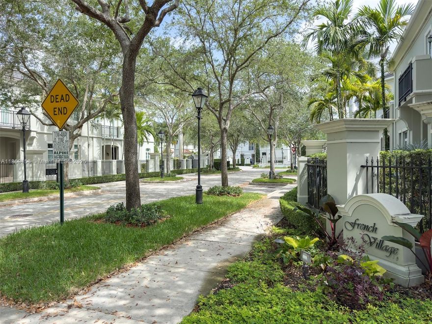 Elegant 4BR/4.5BA villa in Pinecrest’s exclusive 12-home French Village, blending French neoclassical design with refined finishes. Gated entry, private pool, lush landscaping, and 2-car garage. High ceilings, impact windows/doors, gas fireplace, travertine and hardwood floors. Gourmet kitchen with DCS professional appliances, gas range, gas water heater, marble counters, and custom cabinetry opens to family and breakfast areas. Spacious master suite with balcony, large walk-in closet, and luxurious bath with dual sinks, separate tub, and shower. Prime location near US-1, Palmetto, and top-rated schools.