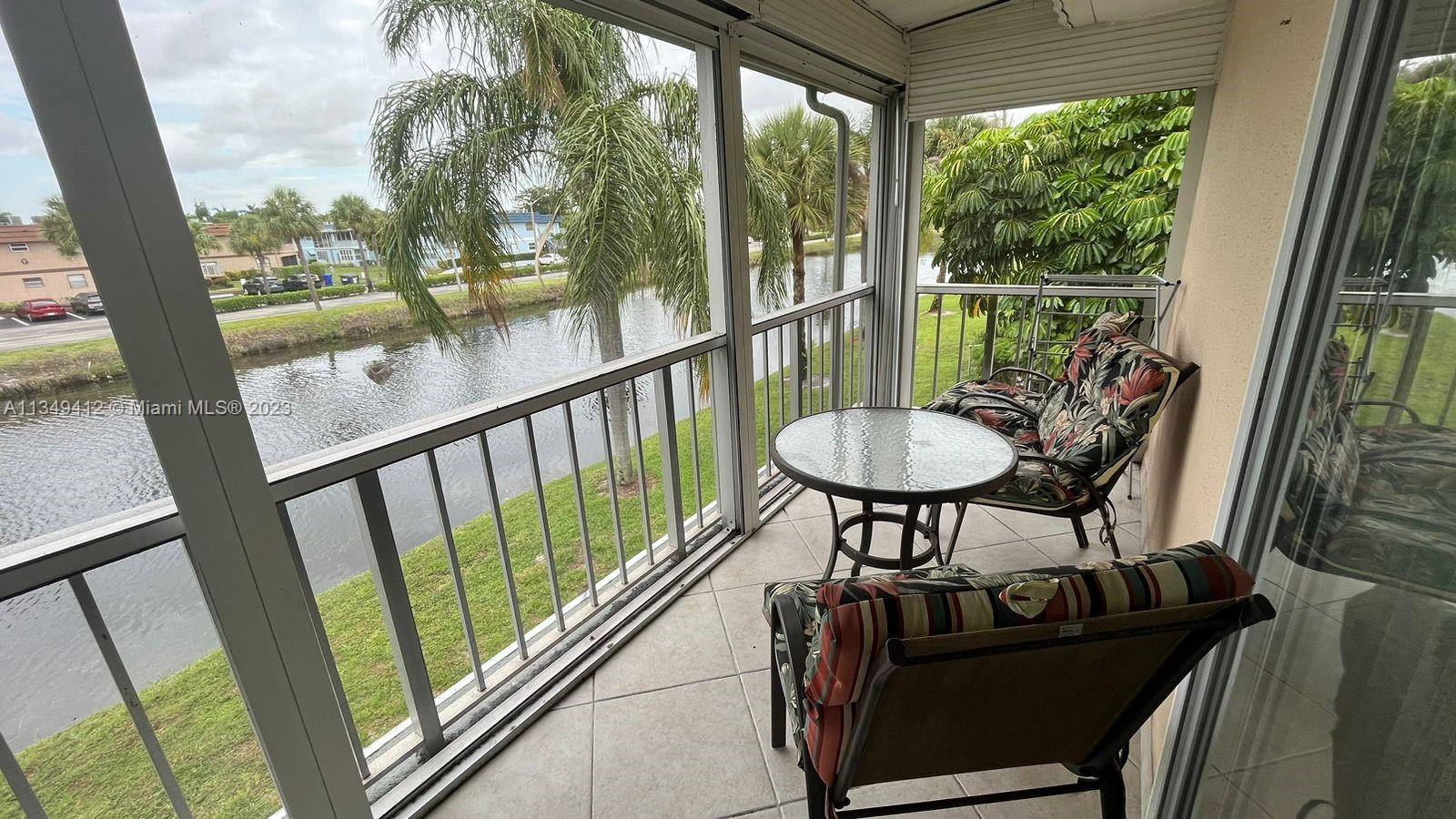 Relax in this turnkey condominium featuring a lovely canal view and located in the Kings Point active adult community. Designer elements in this home include tile flooring and updated fixtures and finishes throughout, hurricane shutters in balcony for added storm protection. Spacious kitchen features tile backsplash, Owner's suite includes one spacious closet, suite bath and direct access to the balcony. Indulge in the canal-view covered balcony offering plenty of space for additional seating, dining, and entertaining. Kings Point amenities include clubhouse with two 18-hold golf courses, pool, tennis, and exercise studio. Here you'll find manned gate, security features, and courtesy shuttle offering add'l convenience. Equal Housing Opportunity.