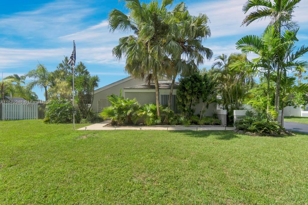 Welcome to this Spacious Corner Lot Gem with NO HOA! This 4/3 home offers nearly 3,000 sqft under air—perfect for large/multi-gen families. Enjoy cooking & entertaining in the updated kitchen featuring granite counters, a center island & brand new stainless steel appliances. A versatile flex room off the kitchen is ideal for walk-in pantry, storage/gym! Garage conversion (legal) creates a private in-law suite, while a permitted family room addition adds flexibility as a second living area/potential 5th bedroom. Step outside to your oversized backyard oasis with a sparkling pool, 3 storage sheds, lush landscaping, and a fruiting avocado tree. The fully fenced lot includes double gate access with a concrete slab on one end for RV/boat parking. A rare find with space, flexibility, & value!