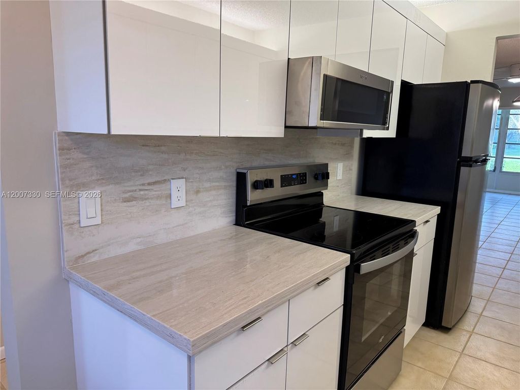 Photo of 12501 SW 14th St #112R, Pembroke Pines, FL 33027 (MLS # A12007330)