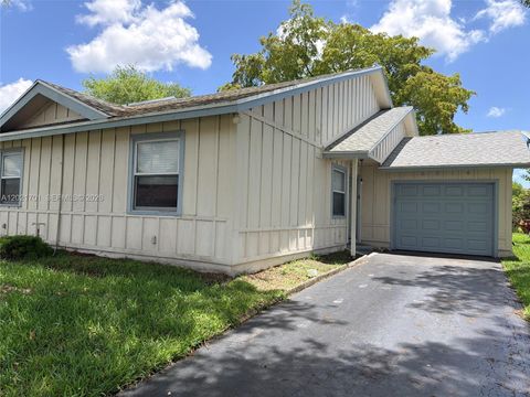 Photo of 6014 NW 78th Way, Tamarac, FL 33321 (MLS # A12021701)
