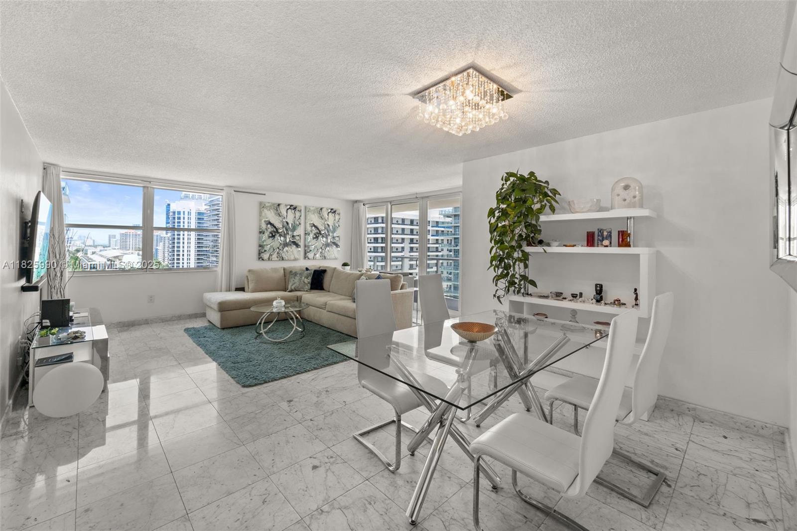 Indulge in breathtaking ocean views from the spacious balcony of this elegantly renovated unit on Millionaire's Row in Miami Beach. This modern residence boasts 1 bedroom, 1.5 bathrooms and a walk-in closet over 1173 SF of luxury living space. Revel in the white marble flooring, updated open kitchen, and modern bathrooms. Enjoy a host of amenities including doorman, gym, pool and a sauna. With ocean access across the street and a Bayfront Pool Deck and Marina, this property offers a truly sophisticated lifestyle.