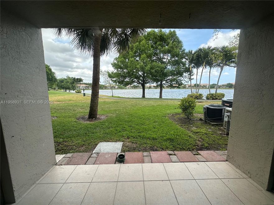 BEAUTIFUL CONDO 3 BEDS 2 BATHS, 1st FLOOR, FACING THE LAKE, 1,300 SQ FT OF LIVING AREA, GATED COMMUNITY WITH ALL AMENITIES, WOOD KITCHEN CABINETS & NEW WHITE GRANITE COUNTER TOPS, BRAND NEW STOVE AND REFRIGERATOR, FULL SIZE WASHER/DRYER, NEWLY PAINTED, LOCATED ACROSS THE STREET MONARCH HIGH SCHOOL AND WALKING DISTANCE TO PROMENADE SHOPPING CENTER, CLOSE TO TURNPIKE AND SAWGRASS EXPRESSWAY. WATER AND SEWER INCLUDED. GO AND SHOW ITS ON LOCKBOX.