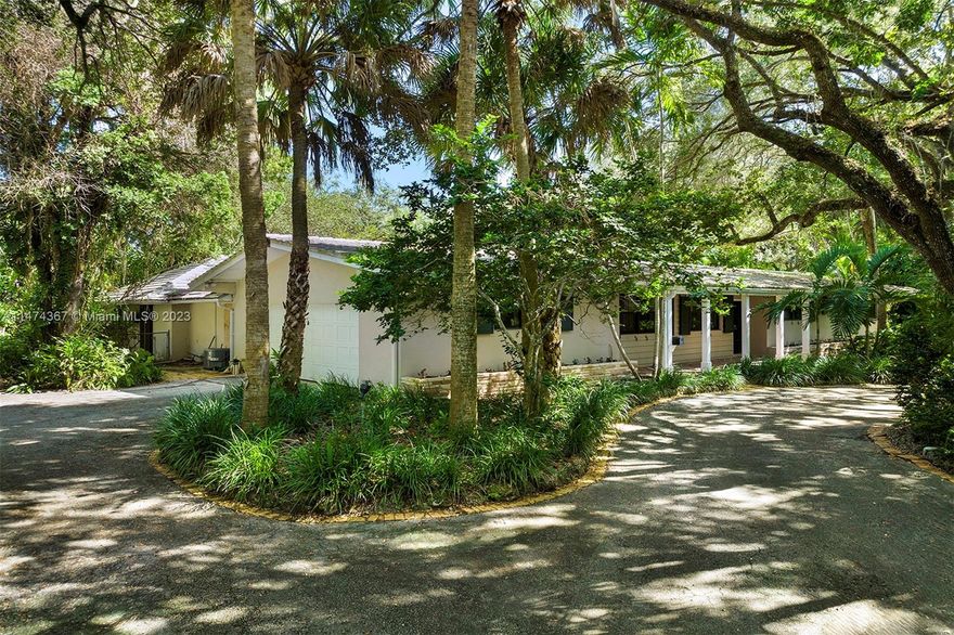 Hidden in the serene enclave of Northeast Pinecrest, this expansive corner sanctuary spans over 33,500 square feet and stands ready to realize your future dreams. It's the perfect spot to construct your custom-made dream home or to relish in the existing structure, previously reimagined by the renowned architect Charles Harrison Pawley. The residence features 5 bedrooms, 3 bathrooms, generous communal spaces, and a 2-car garage. The exterior enchants with a large, inviting swimming pool, a tranquil koi pond, and majestic oak trees, all combining to stir the imagination and soothe the spirit. An unexpected delight includes a stable and paddock, which once served as the home for Saratoga and Eowyn, promising whimsical family escapades. Elite schools nearby.
