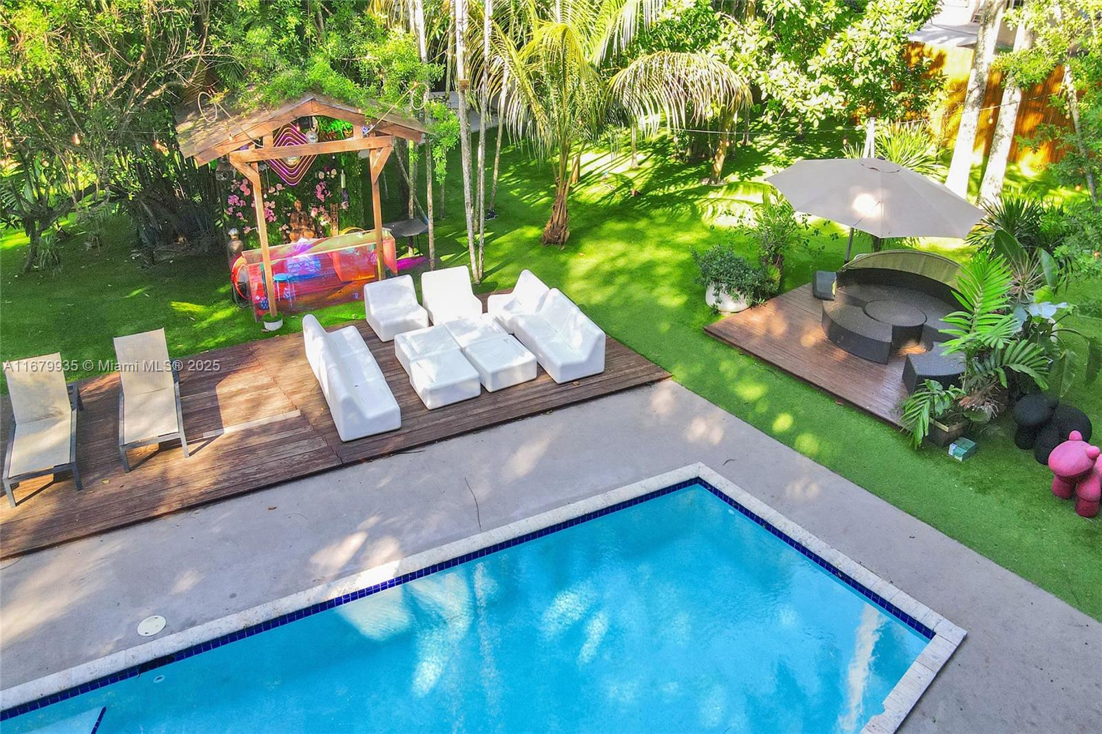 16% CAP RATE AIRBNB PRO-FORMA, see attached docs. Escape to your Spiritual Retreat in the Balinese Junglei! Welcome home to 1000 Palms Hideout! Seriously, we promise you've NEVER seen anything like this. This unique main home offers 4 BR, 2 bath, over 2,000 total SFT on a massive 1.2-acre lot. This magnificent compound can provide multiple streams of income & a path to healing & wellness! Yes, the possibilities are ENDLESS!! Or just do AIRBNB and make a ton of money! With sleek black porcelain tile throughout, 10 ft ceilings (20 ft in the living area). Italian custom kitchen with floor-to-ceiling cabinets, quartz countertops, Jenn Air/Miele appliances. The property also includes 2 Airstream trailers, large deck for outdoor dining , treehouse with full bath, sauna, gym, and more!
