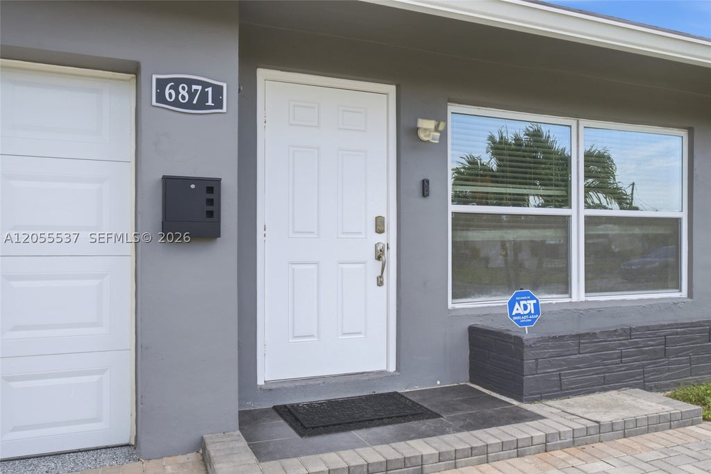 Photo of 6871 NW 28th St, Sunrise, FL 33313 (MLS # A12055537)