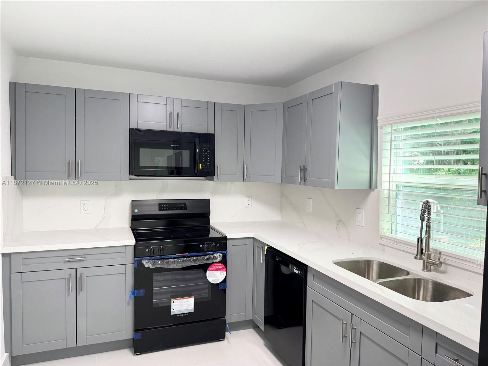 Discover this beautifully remodeled 2-bedroom, 1-bath unit just minutes from the vibrant Miami Design District! This is an exceptional opportunity to live near one of Miami's hottest destinations, filled with dining, shopping, and entertainment options. The property boasts brand-new stainless steel appliances, a stunningly remodeled kitchen and bathrooms, and sleek white tile floors throughout. Don’t miss your chance to own this fantastic home in one of Miami’s most sought-after neighborhoods!