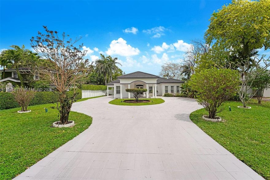 Peacefully set along a tranquil canal in Miami Springs, this light-filled residence offers a spacious open layout with soaring ceilings and an effortless indoor-outdoor feel. Recent updates include new LED lighting throughout, A/C replaced in 2021, sprinkler system, landscape lighting and a brand new water heater. The property also features a substantial detached three-car garage (1,300 SF) with a room and half bath, offering exceptional flexibility for storage or workspace.  This home combines comfort, functionality, and a highly convenient location. Ideally located just an 8-minute walk to Downtown Miami Springs—a charming, historic “Main Street, USA”—and only 5 minutes to Miami Springs Middle School. Less than a 10-minute drive to the new Inter Miami stadium, Miami International Airport, and the Palmetto Expressway, with easy access to SR 112 just 5 minutes away. Miami Springs is celebrated for its charming, small-town feel, strong sense of community, scenic parks, and picturesque tree-lined streets.
