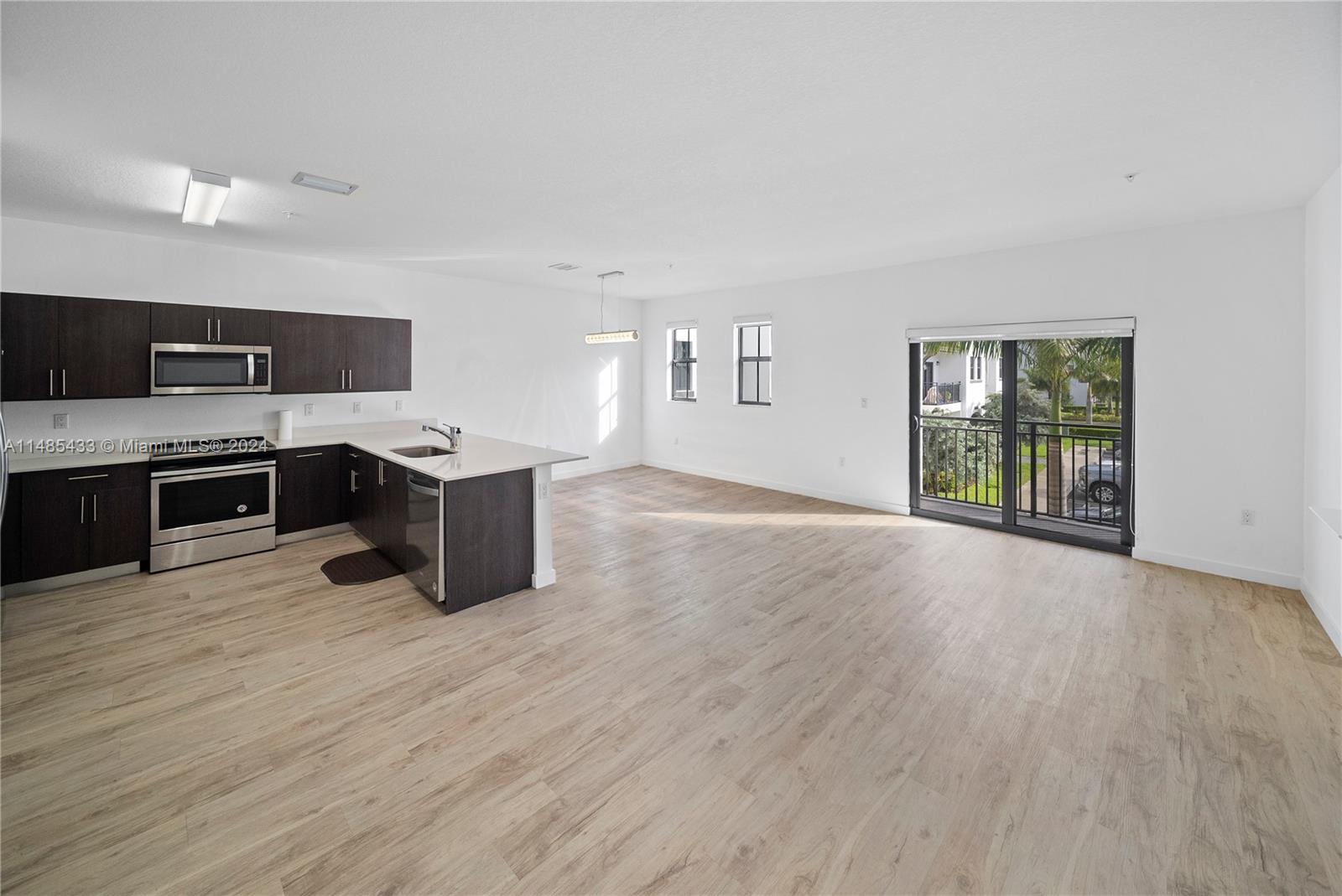 Century Park South. 3 bedrooms 2.5 bathrooms with. Comfortable kitchen with living room, includes appliances such as, kitchen, refrigerator, dishwasher, microwave, Washer & Dryer. Balcony, Waterproof floors throughout, New SS appliances Modern Wood Cabinet kitchen with quartz countertop, 2 assign parking spaces and additional visitor parking spaces. Close to everything and convenient access to major highways near the International University of Florida, Main Highways, Shopping Centers and Schools.