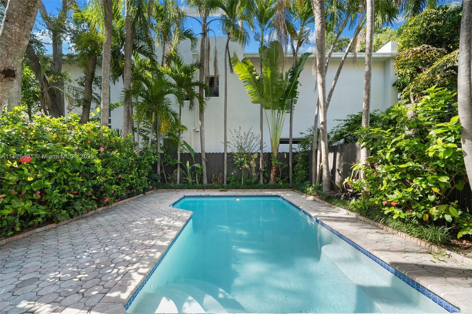 Beautiful townhome in the heart of Coconut Grove, freshly renovated and move-in ready. Surrounded by lush tropical landscaping, the property boasts a covered patio and oversized pool with pool heater, perfect for entertaining. The open floorplan is flooded with light from arched windows, and features granite countertops, stainless steel appliances, and wood and tile floors. Gated and secure with ample parking for 4 vehicles inside and 2 outside. Just seconds from the newly renovated Cocowalk, shopping, dining, nightlife, and the bay. Located in the sought-after Coconut Grove Elementary school district. A Beautiful Miami Home! Make it Rein!