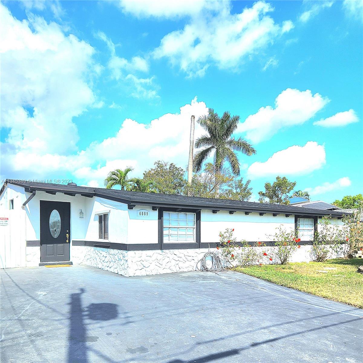 Photo 1 of 74 of 6089 NW 27th St house