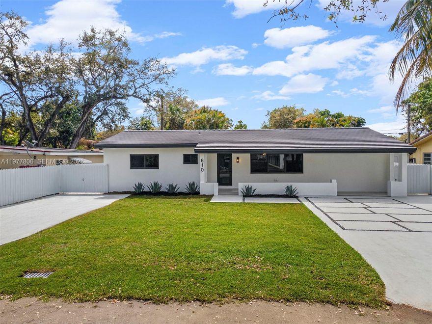 Immaculate almost-new construction offering 7 bedrooms and 4 bathrooms with high-end finishes throughout. This fully remodeled home features a new flat tile roof, impact windows and doors, and is fully fenced for privacy. Interior highlights include large porcelain tile flooring and a stunning designer Italian kitchen with quartzite countertops and backsplash, oversized cooking island, smart stainless steel appliances, microwave drawer, wine cooler, and bar/coffee station. Custom European cabinetry is featured in all closets, while the bathrooms showcase porcelain tile, modern shower panels with glass doors, smart toilets, and LED mirrors for a sleek spa-like feel. The home also includes a separate laundry room, new AC system, and tankless water heater. A private in-law suite or potential rental unit offers 2 bedrooms, 1 bathroom, kitchenette, and separate entrance. The expansive backyard has room for a pool or jacuzzi and includes a concrete slab ready for a pergola or outdoor entertaining area. Custom driveway with decorative rock design and ample parking. Centrally located in the heart of Miami, minutes from beaches and major highways. No HOA.