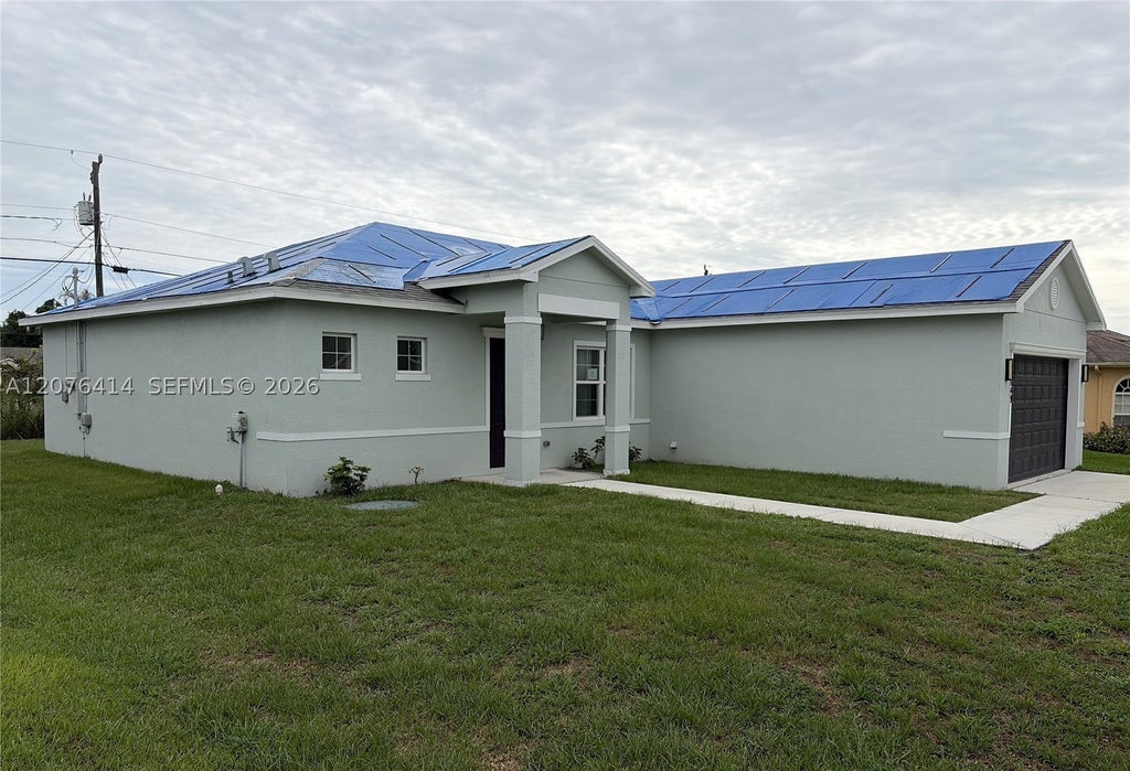 Photo of 1649 SW Merchant Ln, Port St Lucie, FL 34953 (MLS # A12076414)