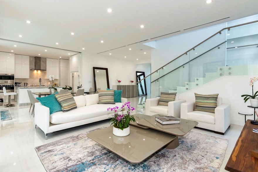 This modern architectural masterpiece w/ soaring ceilings & views of the sparkling pool greet you as you enter this magnificent 5 BD with en suite baths plus 2 half baths. The abundance of natural light throughout create a bright & tropical ambiance w/ oversized sliding hurricane impact doors which frame the open kitchen & living area. Chef’s kitchen features top of the line Sub Zero & Wolf appliances, custom cabinetry and a unique sliding door separating the working areas from the rest of the house. Master suite w/ custom walk-in closet & luxurious marble spa-like bathroom. The lushly landscaped backyard w/ separate cabana area & cabana bathroom, large covered patio & pool. Automated curtains, security cameras and a 2 car garage. Live in your own private oasis in the heart of Miami Beach.