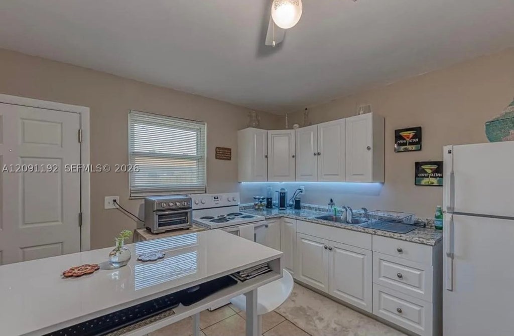 Photo of 1411 NW 10th St #F, Dania Beach, FL 33004 (MLS # A12091192)