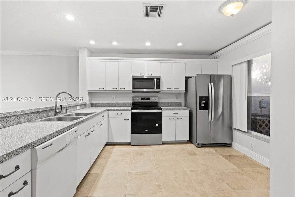 Photo of 1216 NW 51st Way, Deerfield Beach, FL 33442 (MLS # A12104844)