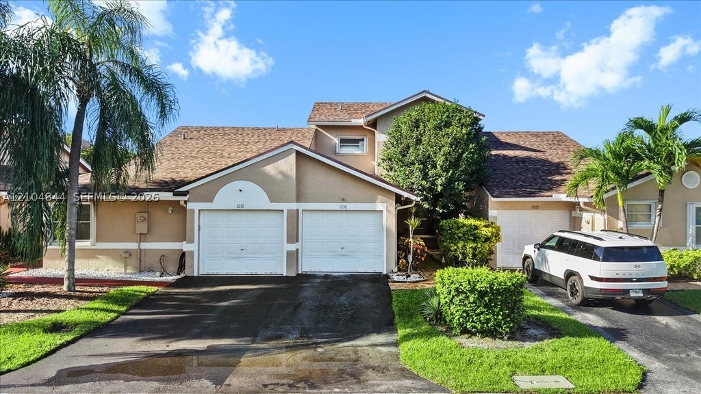 Photo of 1216 NW 51st Way, Deerfield Beach, FL 33442 (MLS # A12104844)