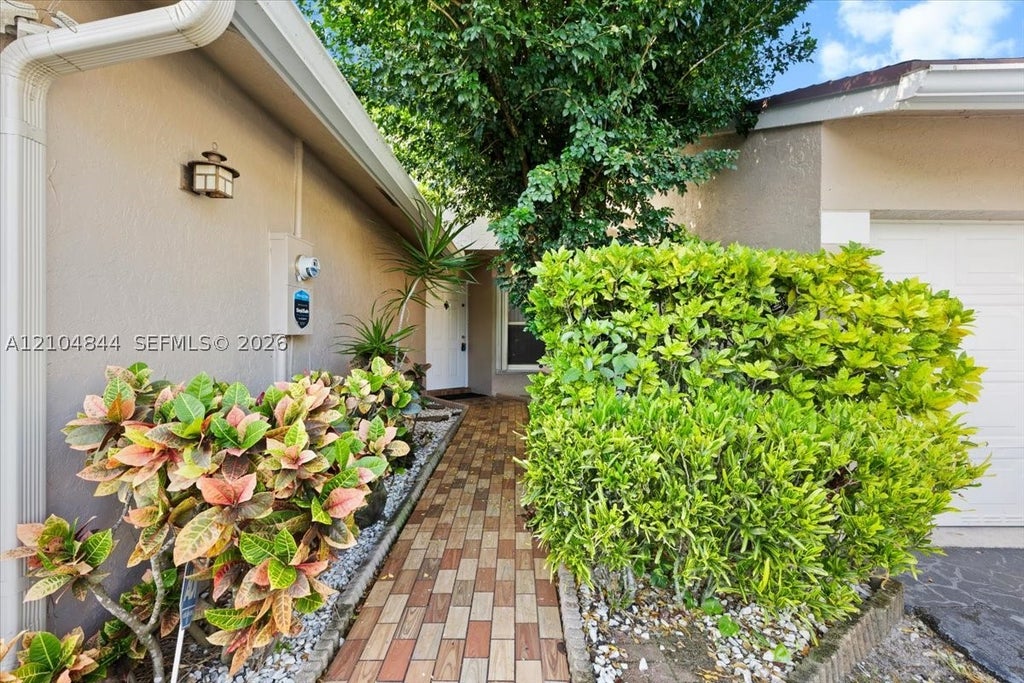 Photo of 1216 NW 51st Way, Deerfield Beach, FL 33442 (MLS # A12104844)