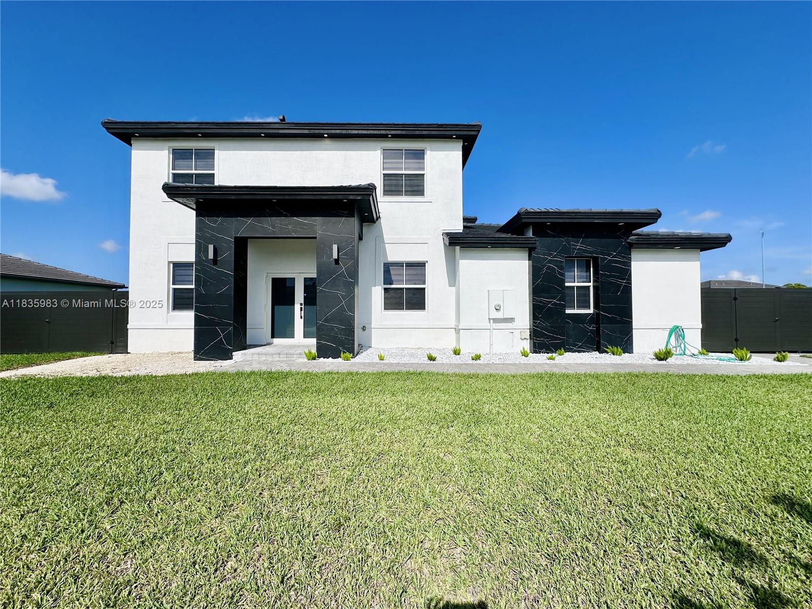 Stunning Single Family Home with Premium Upgrades. Welcome to this beautiful home that offers 5 bedrooms, 4.5 bathrooms, and a three-car garage. Designed for comfort and style, it features custom cabinetry, quartz countertops, premium appliances, garage floor epoxy, and tile flooring throughout. Enjoy peace of mind with impact windows and doors and a saltwater system. For added convenience, there is a full bedroom and bathroom on the first floor, ideal for guests. Step outside to a generously sized backyard, offering plenty of space to build your dream pool and create your own private oasis perfect for entertaining or relaxing in total privacy. This home combines exceptional features and endless potential in a highly desirable location. NO HOA. Schedule your showing today!