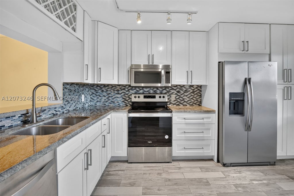 Photo of 900 SW 125th Way #105R, Pembroke Pines, FL 33027 (MLS # A12073246)