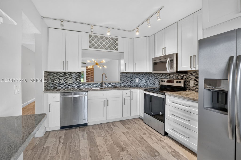Photo of 900 SW 125th Way #105R, Pembroke Pines, FL 33027 (MLS # A12073246)