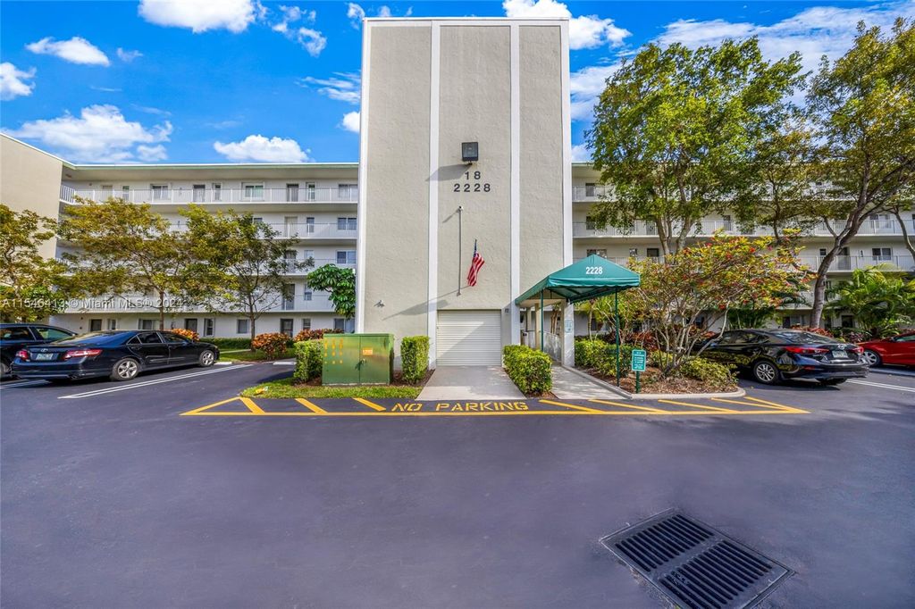 Photo of 2228 N Cypress Bend Dr #206, Pompano Beach, FL 33069 (MLS # A11546413)