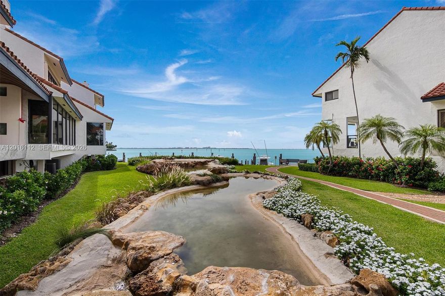 Experience the best of Coconut Grove. L'Hermitage is a private 24/7 gated secured community located in a lush, tropical setting with access to Biscayne Bay.  Nested in a serene and well-maintained complex, this home features a private marina for the community, ideal for boating enthusiasts or those who enjoy kayaking and water sports. The villa has 10ft ceilings, lots of windows, and very spacious. Enjoy peaceful surroundings, vibrant landscaping, and the convenience of being just minutes from great dining, shopping, and all that Coconut Grove has to offer.  A rare find, it is one of the few homes in the community with an elevator.  Brand-new roof and 3 AC units.