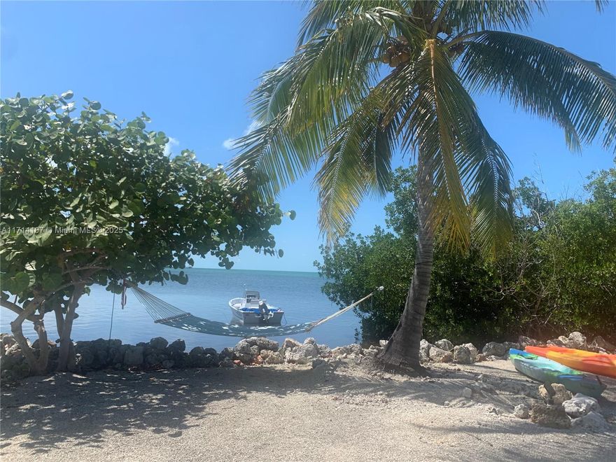 Bayfront Paradise, Rare Opportunity! Motivated Seller!
Unique 0.6-acre bayfront lot next to the marina with privacy and lush surroundings. Existing 1BD/1BA home on site, with plenty of room to build a new house or expand. Close to Dolphin Research Center, shops & restaurants. Easy to show—schedule your showing today!