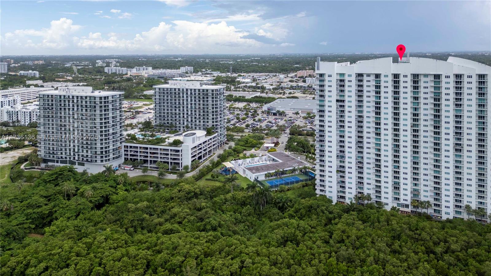 Spacious furnished or unfurnished 3-bed, 3-bath with stunning views of the Oleta Park nature preserve. Master suite with 2 walk-in closets and a luxurious bath with a Jacuzzi tub, dual sinks, and a separate shower. The stylish kitchen includes SS appliances and granite countertops. Enjoy the convenience of an in-unit laundry room with a washer and dryer. Step onto the expansive balcony with newly installed glass railings, enhancing the breathtaking panoramic views. Impact windows provide security and peace of mind. This gated community offers resort-style amenities, including an oversized pool, 24-hour fitness center, tennis court, clubhouse, kids' play area, valet parking, and a dog walking area. Ideally located across from Costco and near FIU, Aventura, beaches, and I-95.