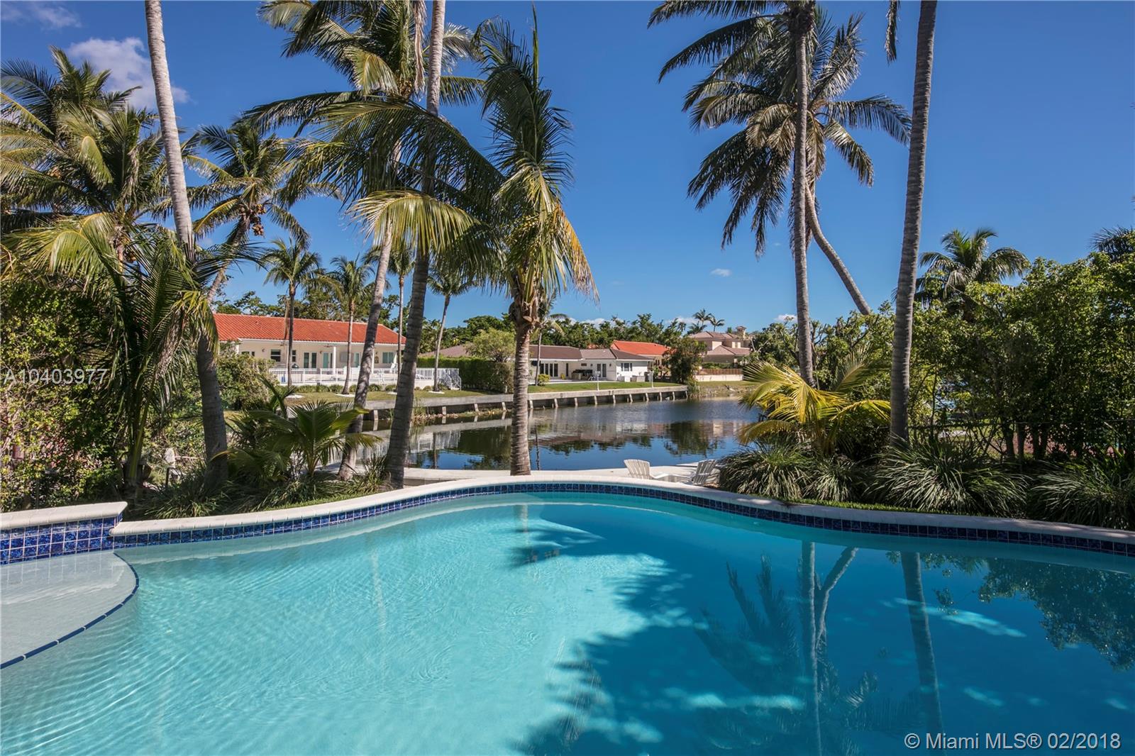 Great corner lot home in Gables by the Sea, close to Gulliver Academy & other schools. Remodeled after hurricane Andrew w/a beautiful view of the canal, this property sits on a 16,566 SQFT lot. New 2016 roof, exterior recently painted, covered terrace for 3 cars & cozy patio w/heated pool that has a seating area & spa overlooking the canal. Eat-in kitchen w/adjacent breakfast area & family rm, bran new dishwasher. On 2nd floor, the large master suite opens to a separate space for office/nursery. Also on 2nd floor, there are 2 more bedrms, 1 bathrm, an open den that can be used as a sitting/guests area & a storage space. Other features in this home are: seawall, accordion shutters, electrical rolling screens in the open back terrace & sprinklers. Chandelier in living rm excluded from sale.