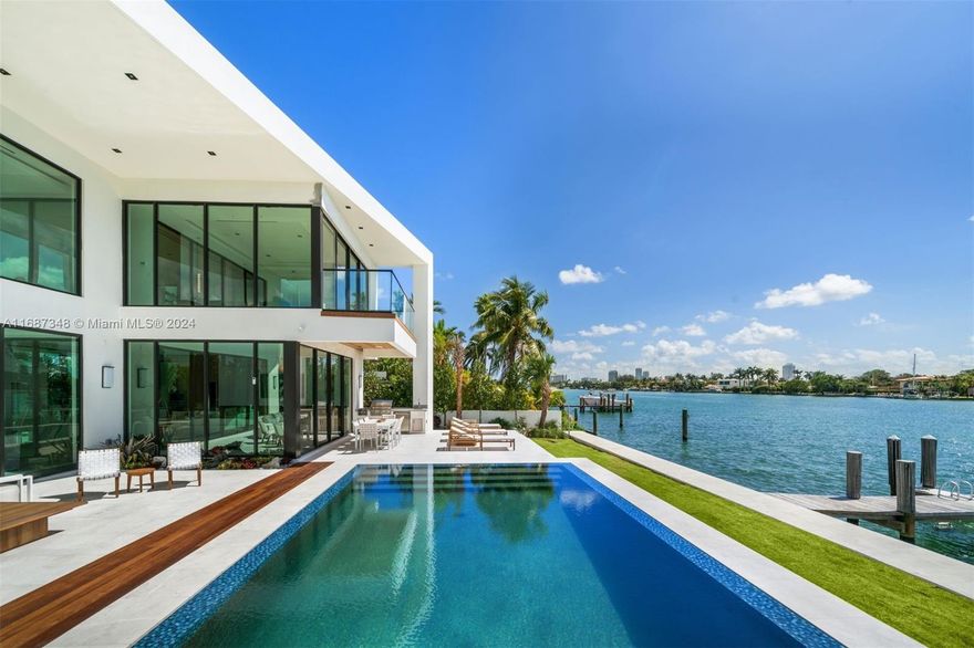 Indulge in opulent waterfront living in this brand-new construction home with a premier lot position on the wide
bay in gated Biscayne Point. Enjoy the most sought-after Southern Exposure close to the tip of the island.
Designed by Tamara Feldman, this modern masterpiece boasts 7BD/7+1 BA. The exquisite interior features Tundra grey Marble & White oak flooring, white oak wrapped floating staircase, & Carrara marble in all guest bathrooms. The exterior facade is wrapped in stone, complemented by a knife-edge pool & stunning water views. Enjoy a chef’s kitchen w/ marble & custom white oak, top of the line appliances, a media room, staff quarters & full cabana bath. Revel in luxury & sophistication at every turn in this stunning waterfront retreat.