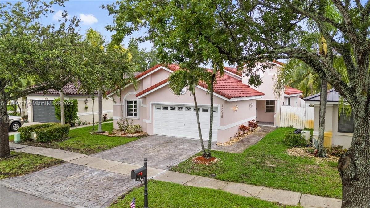 Welcome to this Delightful One-Story Home Nestled in the Sought-After Neighborhood of Tiffany Cove. Featuring 4 Bedrooms, 2-Baths, 2-Car Garage. Open Concept Kitchen & Family Room. Luxurious Quartz Counter Tops & Stainless-Steel Appliances, Spacious Living Room/Dining Area. Elegant Ceramic Tile Flooring Throughout. Private Patio W/ a Screen Enclosure, Perfect for Entertaining Guests. Accordion Shutters, Fenced in Back Yard. Walking Distance from Community Pool. A+ Rated Schools, making this home a Perfect Choice for Families. This Community, offers Beautiful Walking Tracks, Large Serene Lakes, Tennis Courts, Picnic Area, Beach Volleyball & Much More.